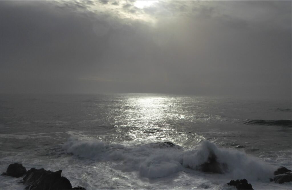 Glowing reflections on a stormy sea. Photo by Kathleen Berry