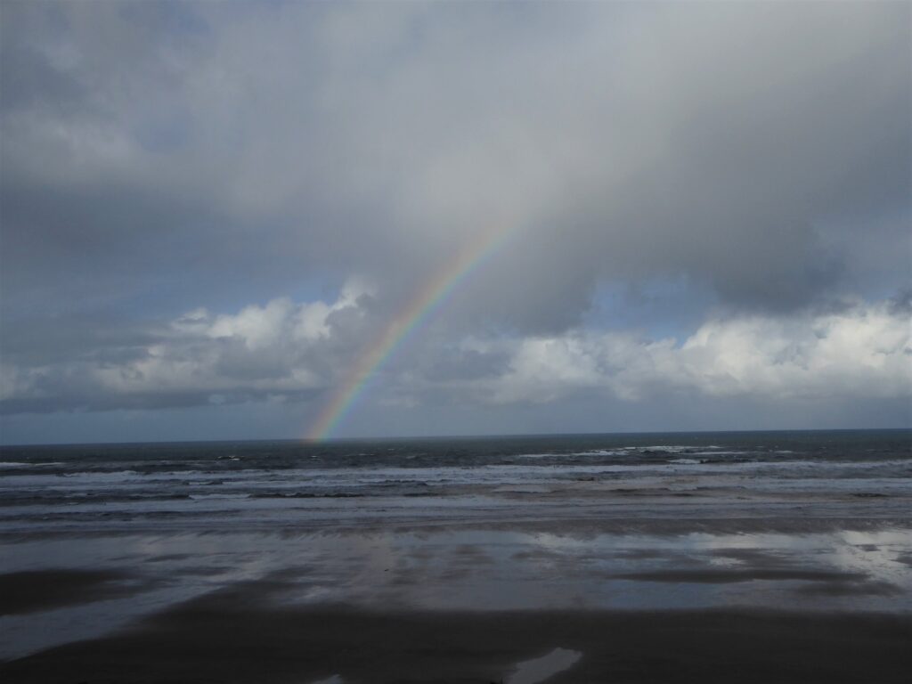 Rainbow over a stormy sea